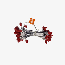 A bundle of 12-volt copper wire with single color SMD LEDs, approximately 5 inches apart, against a white background.