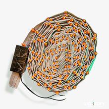 Coiled cable with orange lights on a white background