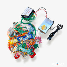 Colorful LED string lights with control device on a white background