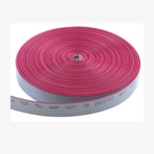 A pink flat ribbon cable (FRC) with connectors on both ends, displayed alongside a strip of white insulation material.
