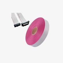 A pink flat ribbon cable (FRC) with a gray layer in the middle, shown alongside a pair of connectors.