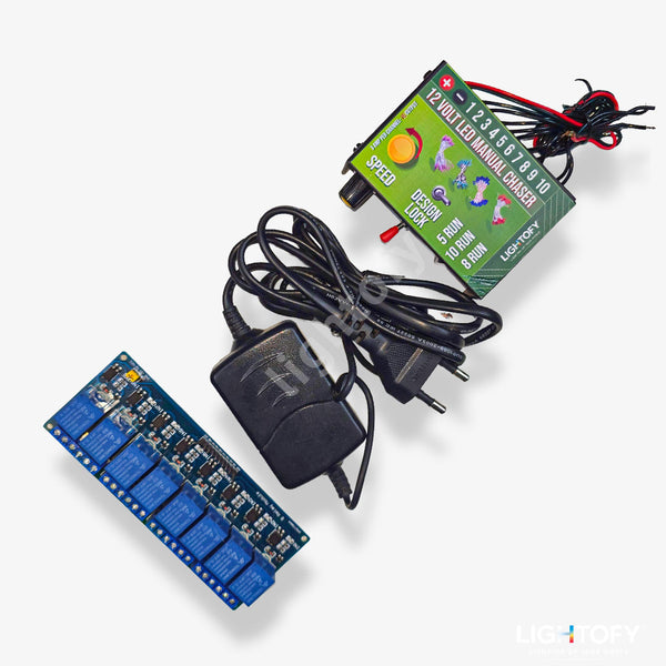 Electronic components including a green circuit board, blue relay module, and power adapter on a white background.