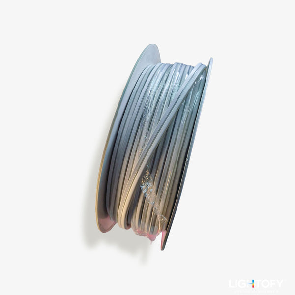 Spool of filament with gradient color on a white background
