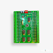 Green electronic circuit board with various components on a white background