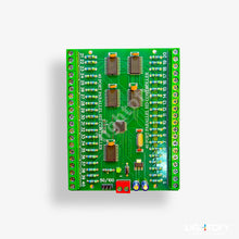 Green electronic circuit board with various components on a white background