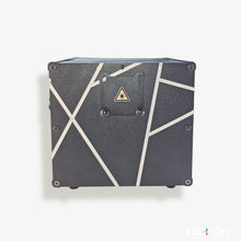 Black electronic device with geometric design on a white background