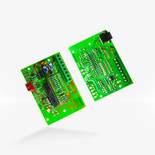 Two green circuit boards for the 8 PORT JINIX CONTROLLER J2000, with electronic components and connectors visible.