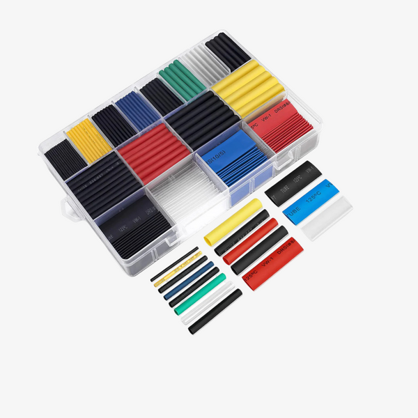 A variety of colored heat shrink tubing in a clear plastic storage container, with compartments for each color.