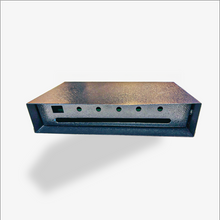 Metallic rectangular object with a textured surface on a white background