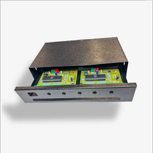Electronic component with printed circuit board inside a metallic housing on a white background