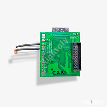 Green electronic circuit board with wires on a white background