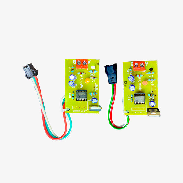 Two green pixel LED data amplifiers with red and black wires, along with a black power adapter.