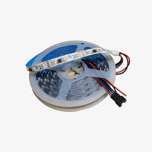 A spool of PIXEL LED dual data strip lights with visible RGBIC chips on a reel.