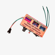 A manual parallel controller for pixel LED with a speed knob and selection dial, connected by wires to a pixel LED strip.