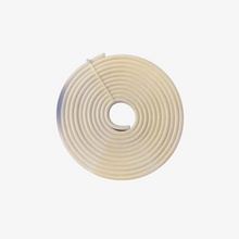 A coiled flexible LED strip light.