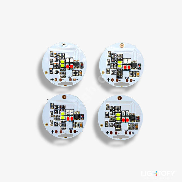Four round electronic components with circuitry on a white background