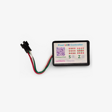 A Pixel LED controller for building decoration with a QR code and connection points visible on the front panel. It is connected to a LED matrix via a multi-pin connector.