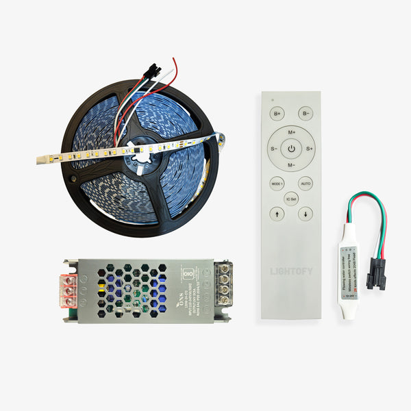 The image shows a set of components for the PIXEL LED WATER FLOW KIT which includes a reel of LED strip lights, a power supply unit, a CCT flowing water controller, and a remote.