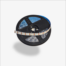 Spool of LED strip light on a white background