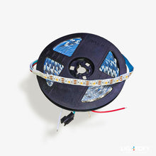 Spool of LED strip light with blue and white color pattern on a white background