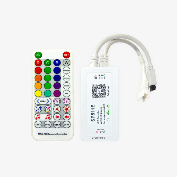 SP511E LED controller with a remote, featuring a white color and a QR code on the label, with multicolored buttons on the remote.